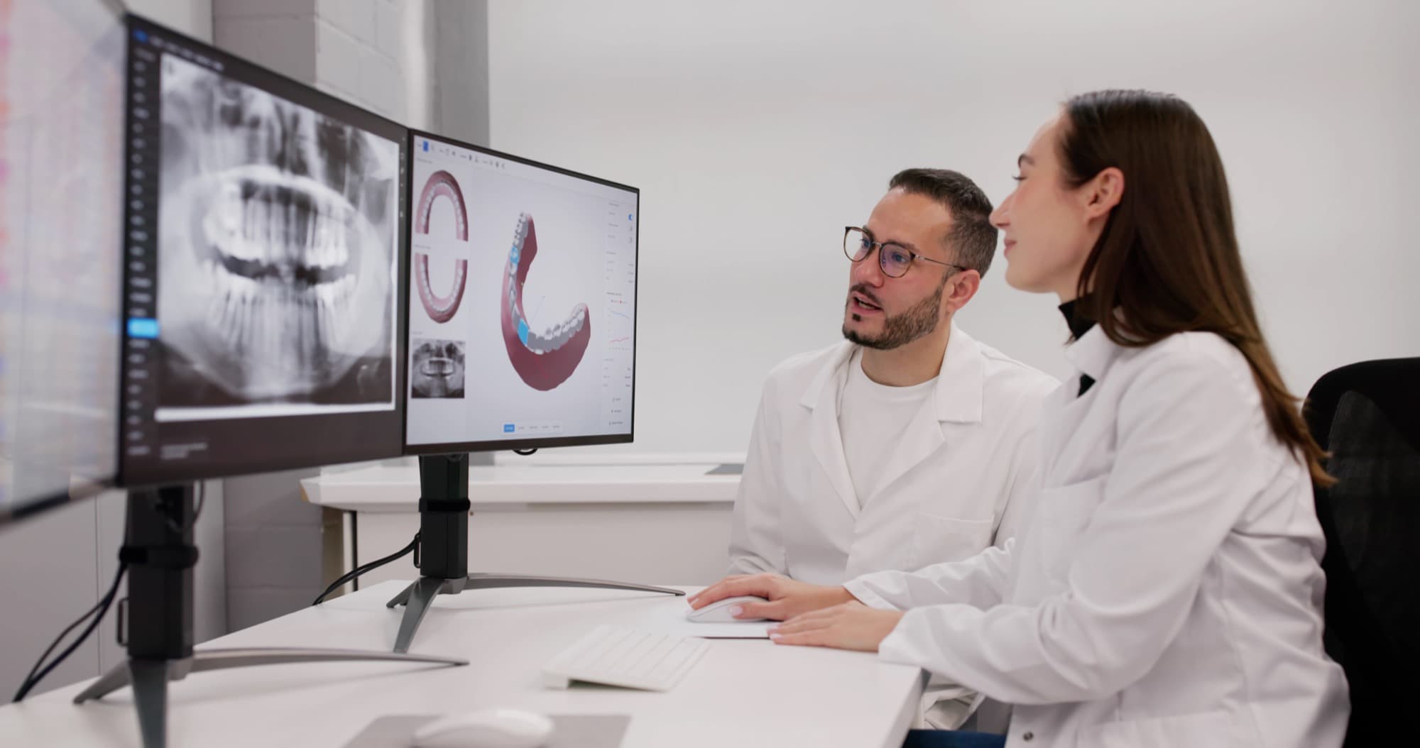 Clinicians reviewing digital dental imaging together
